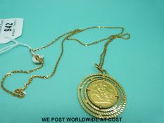 An 18ct gold pendant set with a 1963 full gold sovereign, on 18ct gold chain (17.