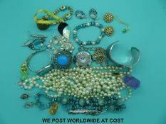 A quantity of costume jewellery to include faux pearls, Swarovski model of an egg timer,
