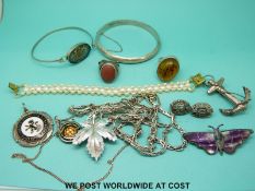 A quantity of silver jewellery to include a bangle, a silver ring, silver earrings,