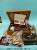 A large quantity of costume jewellery to include a faux pearl, faux pearl necklaces,