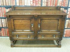 An oak sideboard with two drawers and two cupboards (H90xW135xD47cm)