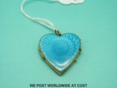 A large Victorian yellow metal locket in the form of a heart,