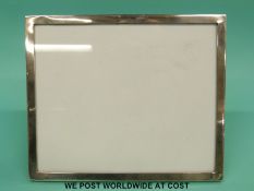 A hallmarked silver photograph frame to suit approx 6 x 7 inch photo,