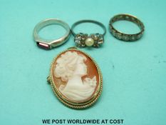 A 9ct gold brooch set with a cameo and three rings