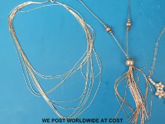 Four silver necklaces,