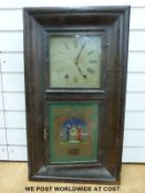 A mid to late 19thC American ogee cased wall clock with 8 day movement striking on a gong,