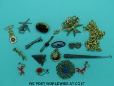 A silver guilloche enamel brooch, two white metal brooches,