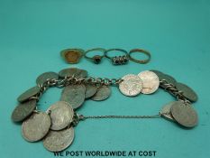 A 9ct gold ring set with a sapphire surrounded by diamonds, two other 9ct gold rings,