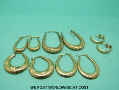 A collection of gold earrings