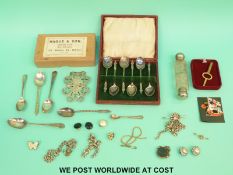 A hallmarked silver belt buckle, Birmingham 1902, chains, fob, spoons,