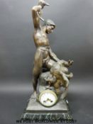 A French spelter clock in the form of a classical figure in loincloth slaying an eagle,