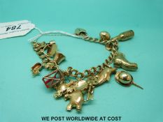 A 9ct gold charm bracelet with fourteen 9ct and yellow metal charms (32.