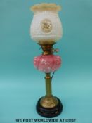 A late 19th / early 20thC brass and glass oil lamp converted to electricity with pink relief
