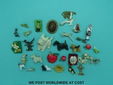 A quantity of brooches mainly in the form of dogs, to include an enamel terrier,