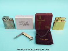 A boxed Ronson standard gold plated lighter,