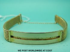 A yellow metal bracelet (24.