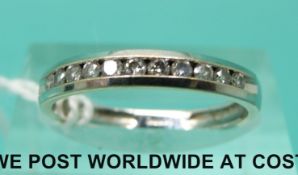 A 9ct white gold half eternity ring set with diamonds (size N)