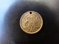 A gold 1896 holed cinco pesas,