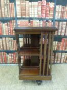 A revolving mahogany bookcase (H88xW38xD38cm)