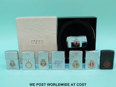 Seven Zippo military related lighters together with a Zippo Fort Austin Belt,