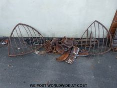 Two hay racks, a blacksmith's vice and various cast iron grates.