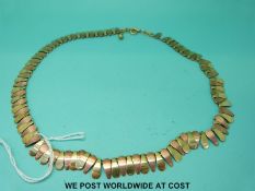 A 14ct bi-coloured gold necklace of pear shaped sections (22.