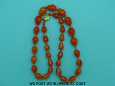Two bakelite coral style beaded necklaces and two glass bead necklaces.