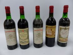 Five bottles of red wine comprising two bottles of Chateau Saint Pierre Sevaistre 1979,