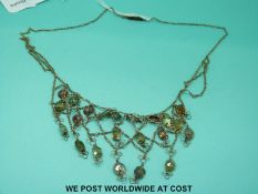 A possibly French filigree necklace set with quartz