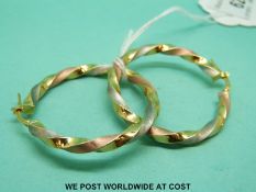 A pair of 9ct gold tricolour rope twist hoop earrings