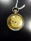Cuivre Swiss yellow metal ladies keywind fob watch with chased decoration to case, stamped 9K, no.