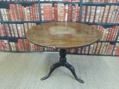 A 19thC mahogany circular tilt top raised on a tripod base (H70xD86cm)