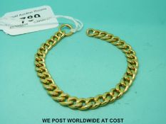 A yellow metal curb link bracelet (34.