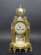 A 19thC French gilt brass cased mantel clock with Sevres style panel and dial decoration,