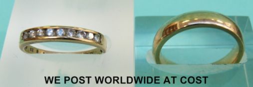 A 9ct gold wedding band and a 9ct gold ring set with nine diamonds (5.