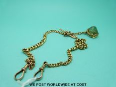 A graduated 9ct gold double Albert with a citrine fob.