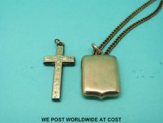 A yellow metal shield shaped locket marked 15ct (8.