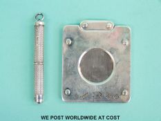 A feature hallmarked silver cigar cutter and a retractable hallmarked silver tooth pick