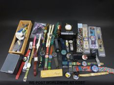 A collection of Swatch watches etc.
