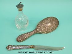 A hallmarked silver backed brush,