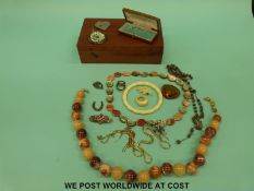 A collection of costume jewellery to include an abalone necklace, silver Russian style wedding band,