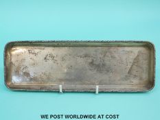 A George V hallmarked silver dressing table tray, Birmingham 1911, length 21.