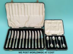 A cased set of 12 butter knives with hallmarked silver handles and six cased hallmarked silver