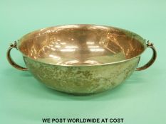 A Georg Jensen white metal twin handled dish, of hammered design,