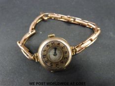 Regina 9ct gold ladies half hunter wristwatch with blue hands and Arabic numerals to the face and