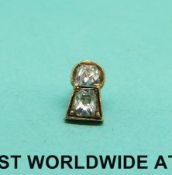 Two old mine cut diamonds in yellow metal mount