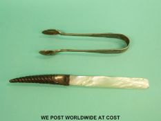 A pair of hallmarked silver tongs and a hallmarked silver mounted mother of pearl letter opener