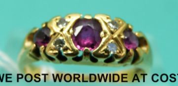 An 18ct gold ring set with rubies and diamonds (size M)