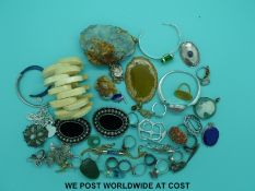 A collection of silver to include rings, bracelets, brooches, a pair of buckles,