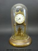 A brass anniversary clock under glass dome (29cm tall)
